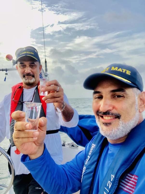 Julio and crew celebrate sailing. 
