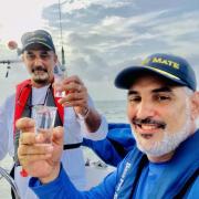 Julio and crew celebrate sailing. 